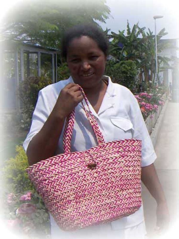  9. Mme Raton with a bag made using the craft technique that involves first braiding raffia into ribbons, then sewing them together into a bag or hat. (More on this crafting technique further down the page.)