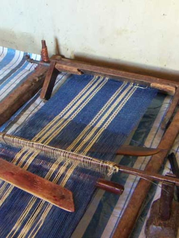 12. There are two homemade handlooms in the house. When they don’t use the handlooms, they disassemble and put the pieces by the wall.