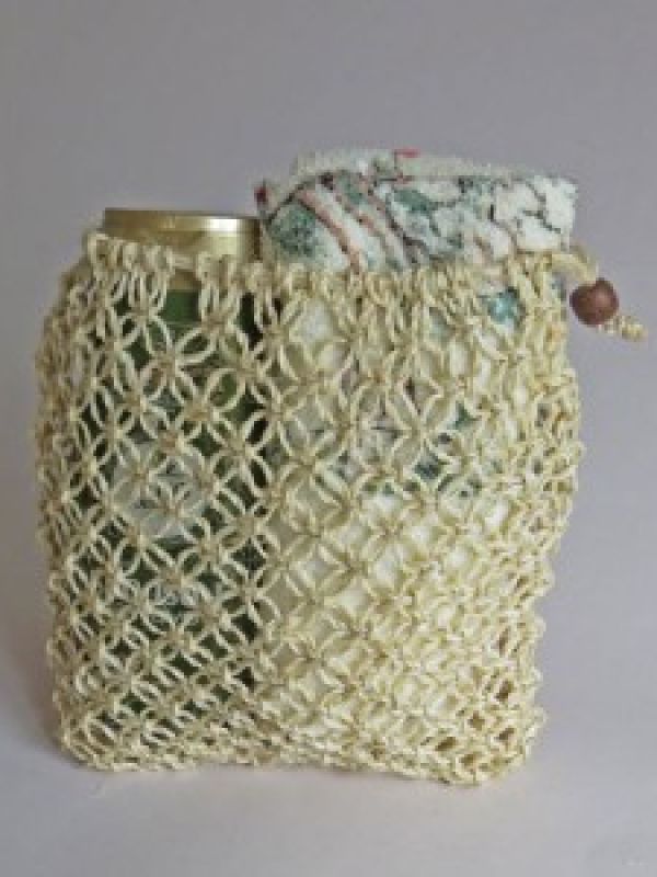 Spa-bag macramé-tied of naturewhite sisal. Click below to find it in La Maison Afrique FAIR TRADE assortment. 